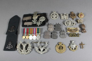 A group of 5 miniature medals comprising 1939-45 Star, Burma Star, Defence War medal and Territorial Efficiency medal, a  collection of cap badges and Boys Brigade badges