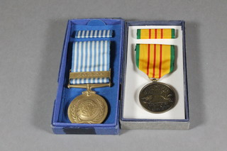 An American Vietnam service medal and a United Nations Korea medal