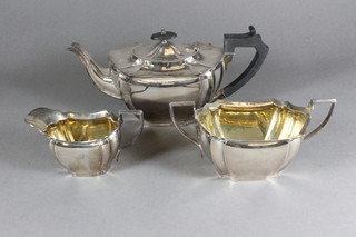 An oval silver plated 3 piece tea service with teapot, twin  handled sugar bowl and milk jug