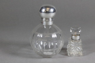 A circular cut glass perfume bottle with silver lid, Chester 1913 4" and a small cut glass dressing table jar with silver collar