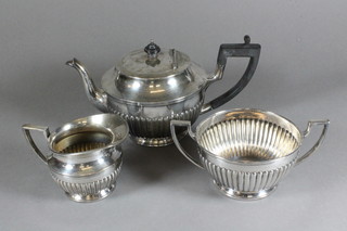 A circular Britannia metal 3 piece tea service with teapot, sugar  bowl and milk jug