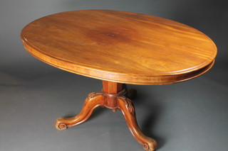 A Victorian mahogany oval breakfast table, the moulded top supported by a tapering column, raised on tripod base, scroll feet  28.5"h x 54.5"w x 39"d