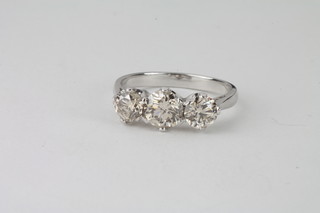 A lady's 18ct white gold dress/engagement ring set 3 circular cut diamonds, approx 1.84ct