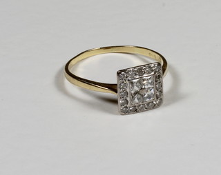 An 18ct yellow gold square shaped dress ring set numerous  diamonds