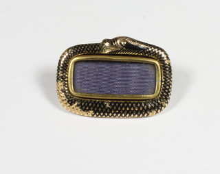 A gold and enamelled mourning brooch in the form of a serpent