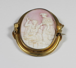A shell carved cameo brooch contained in a gilt metal mount decorated a classical scene