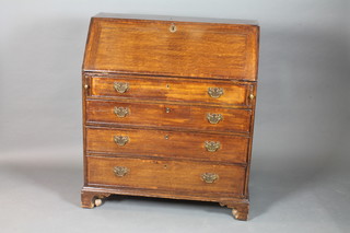 A George III north country oak bureau, crossbanded, the fall enclosing a fitted interior above 4 graduated long drawers on  shaped bracket feet 44"h x 38.5"w x 19"d