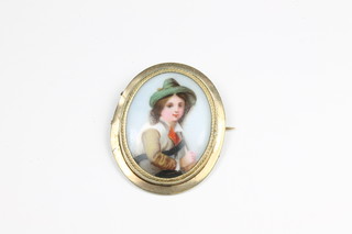 A 19th Century Continental porcelain brooch contained in a gilt  metal mount