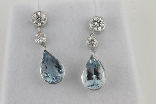 A pair of lady's 18ct gold tear drop shaped earrings set aquamarines and diamonds, approx 2.05ct/0.60ct
