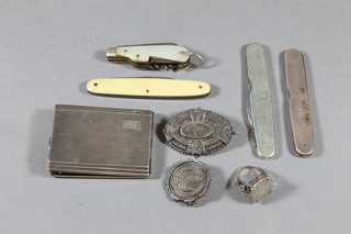 A silver match slip with engine turned decoration, 4 pocket knives, 2 silver brooches and a dress ring