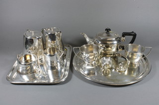 A circular 3 piece silver plated tea service, a 4 piece silver plated  hotelware tea service and 2 silver plated trays