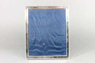 A modern silver easel photograph frame 11" x 9"