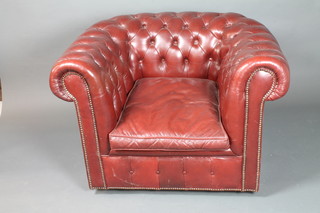 A Victorian style maroon buttoned leather Chesterfield armchair