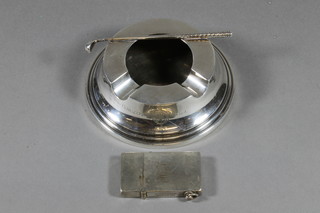 A circular silver plated golfing ashtray decorated a golf club marked Royal Calcutta Golf Club and a silver plated lighter