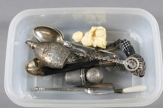 A silver model of an anointing spoon, 2 teaspoons, 2 silver thimbles etc