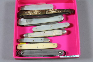 A Victorian silver bladed fruit knife with mother of pearl grip, 3 other knives with mother of pearl grips and a collection of pocket  knives