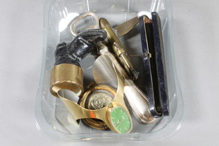 A brass and steel vesta case decorated a sailor, an iron and brass  match striker in the form of a boot 2", a trench art lighter and a  gold mounted cigarette holder etc