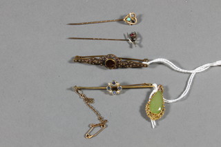 A 15ct gold bar brooch, a gilt metal pendant set green polished  hard stone, a gilt metal brooch and 2 stick pins