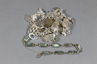A silver curb link charm bracelet hung numerous charms, 1 other bracelet and an oval white metal pill box