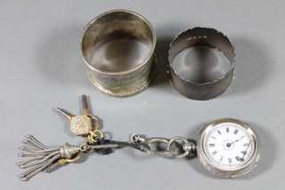 An open faced fob watch contained in a silver case together with  2 small napkin rings