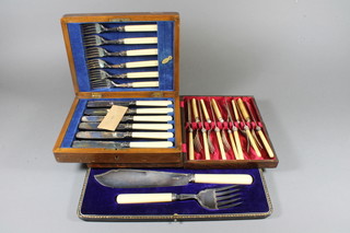 A pair of silver plated fish servers, cased, 2 sets of 6 silver plated fish knives and forks cased