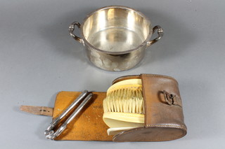 A silver plated twin handled dish, a pair of nut crackers and other plated items