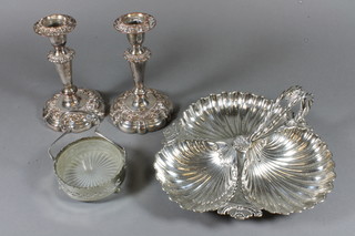 A pair of 19th Century silver plated candlesticks with detachable  sconces 7", a silver plated butter dish, and a 3 section dish