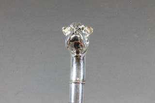 An ebony cane with Continental silver handle in the form of a bulldog