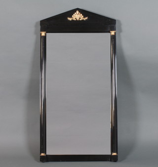 An Empire style ebonised and parcel gilt pier glass of  architectural form, the pediment centred with an anthemion above  a rectangular bevelled plate flanked by split pilasters, plinth base  48"h x 24"w