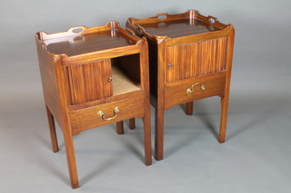 A pair of mid George III style mahogany night tables, having galleried top above a tambour door with drawer below, raised on  square chamfered legs 31"h x 19"w x 17"d   ILLUSTRATED