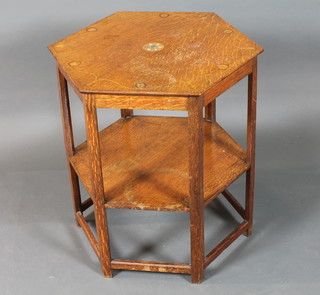 An English Art Nouveau oak hexagonal 2 tier occasional table,  the top decorated with floral marquetry of entwined bell flowers,  raised on shaped supports united by stretcher 25.5"h x 21"w x  21"d