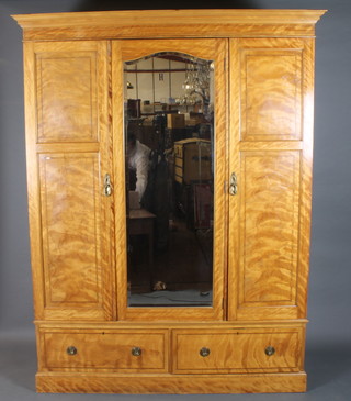 James Parkinson Liverpool, an Edwardian satinwood wardrobe, ebony and boxwood line inlaid with moulded cornice above a  central mirrored door, flanked by 2 fielded panelled cupboard  doors, 1 enclosing shelves with 2 short drawers below, raised on  plinth base, 83"h x 64"w x 24"d