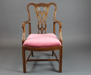 A Chippendale style open arm carver chair with upholstered  drop inset seat, on square tapering supports with H framed stretcher, late 19th Century,
