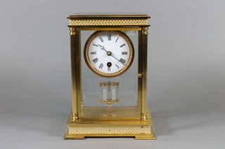 An early 20th Century French gilt brass four glass timepiece with Roman enamelled dial, the cylinder movement with anchor  escapement and mercury compensated pendulum 9.25"h x 7"w x  5"d