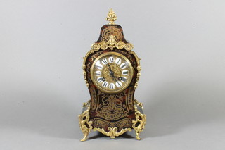 A 19th Century French ebonised and boulle work mantel clock,  gilt metal mounted, the case decorated in premier partie set  Roman enamelled tablet dial to an 8 day cylinder movement  chiming gong, 12"h x 6.5"w x 4"d