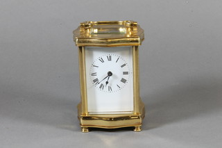 An early 20th Century French gilt brass carriage timepiece having Roman painted dial, set lever escapement, 6"h x 4"w x  3"d