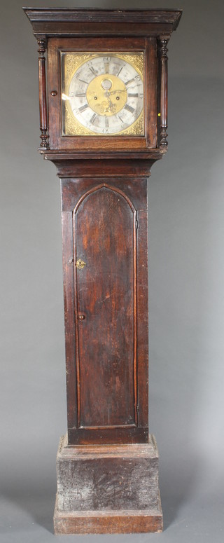 Barber, Winsters, a late 18th Century oak longcase clock, having a 12" square brass dial with silvered Roman and Arabic chapter  ring, set moon phase, date aperture and 8 day striking bell, two  train movement, associated. The case with moulded cornice  above column supports and a lancet trunk door, on box plinth  base, 79"h x 22w