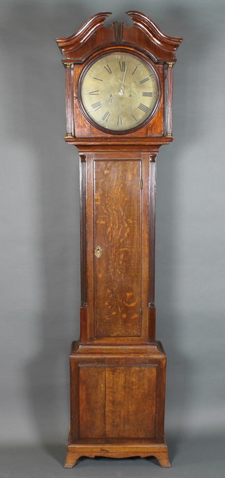 J Mosley, Peniston Yorkshire, a mid 18th Century oak longcase clock, the case with broken swan neck pediment above a pair of  fluted column supports, the trunk with rectangular moulded door  flanked by reeded quarter pilasters, raised on a box base with  splayed feet, having a 14" circular brass Arabic and Roman dial  with second subsidiary and date dials, set 8 day two train  movement with anchor escapement striking bell, 85"h x 21"w x  12"d