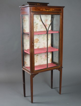 An Edwardian inlaid mahogany display cabinet with raised back, fitted shelves enclosed by an astragal glazed door, 23"w x 11"d  x 56"h