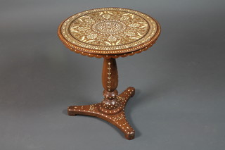 An Anglo Indian hardwood circular occasional table, the top profusely inlaid with ivory and bone depicting birds amongst  flowers, raised on a baluster turned column, triform base, 19.5"h  x 18"diameter