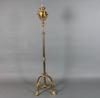 A Victorian brass adjustable oil lamp stand converted to an electric standard lamp