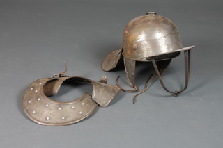 A Cromwellian style lobster tail helmet together with a gorget