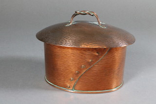 An Art Nouveau oval planished copper caddy 5"