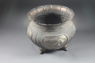A circular Japanese bronze jardiniere decorated birds raised on  panel supports