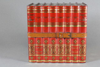 A Huntley & Palmer biscuit tin in the form of 8 red books 6"