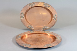 A pair of Art Nouveau oval embossed copper dishes 13"