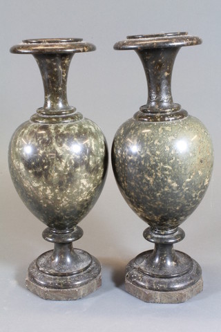A pair of turned serpentine club shaped urns, 1 f and r, 13"