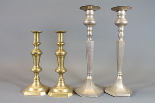 A pair of 19th Century brass candlesticks with ejectors 12" and a  pair of metal chamfered candlesticks 16"