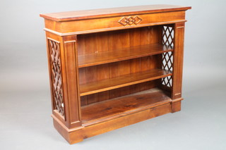A pair of Victorian style bleached mahogany dwarf bookcases  with lattice side panels, on platform bases 42"w x 13"d x 33"h