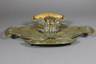 A German Art Nouveau gilt metal lily pad shaped standish with square cut glass inkwell 12", the base marked Geschutzt
